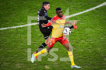 2023-01-14 - Salis ABDUL SAMED of Lens and Mathias AUTRET of Auxerre during the French championship Ligue 1 football match between RC Lens and AJ Auxerre on January 14, 2023 at Bollaert-Delelis stadium in Lens, France - FOOTBALL - FRENCH CHAMP - LENS V AUXERRE - FRENCH LIGUE 1 - SOCCER