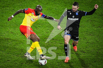 2023-01-14 - Seko FOFANA of Lens and Gaetan PERRIN of Auxerre during the French championship Ligue 1 football match between RC Lens and AJ Auxerre on January 14, 2023 at Bollaert-Delelis stadium in Lens, France - FOOTBALL - FRENCH CHAMP - LENS V AUXERRE - FRENCH LIGUE 1 - SOCCER