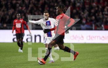 2023-01-15 - Christopher Wooh of Rennes, Neymar Jr of PSG (left) during the French championship Ligue 1 football match between Stade Rennais and Paris Saint-Germain on January 15, 2023 at Roazhon Park in Rennes, France - FOOTBALL - FRENCH CHAMP - RENNES V PARIS SG - FRENCH LIGUE 1 - SOCCER