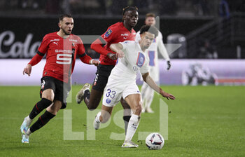 2023-01-15 - Warren Zaire-Emery of PSG, Amine Gouiri, Lesley Ugochukwu of Rennes during the French championship Ligue 1 football match between Stade Rennais and Paris Saint-Germain on January 15, 2023 at Roazhon Park in Rennes, France - FOOTBALL - FRENCH CHAMP - RENNES V PARIS SG - FRENCH LIGUE 1 - SOCCER