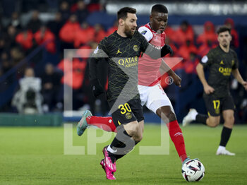 2023-01-30 - Lionel Messi of PSG, Marshall Munetsi of Reims during the French championship Ligue 1 football match between Paris Saint-Germain (PSG) and Stade de Reims on January 29, 2023 at Parc des Princes stadium in Paris, France - FOOTBALL - FRENCH CHAMP - PARIS SG V REIMS - FRENCH LIGUE 1 - SOCCER