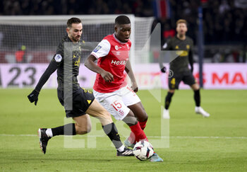 2023-01-30 - Marshall Munetsi of Reims, Fabian Ruiz Pena of PSG (left) during the French championship Ligue 1 football match between Paris Saint-Germain (PSG) and Stade de Reims on January 29, 2023 at Parc des Princes stadium in Paris, France - FOOTBALL - FRENCH CHAMP - PARIS SG V REIMS - FRENCH LIGUE 1 - SOCCER