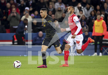 2023-01-30 - Achraf Hakimi of PSG, Yunis Abdelhamid of Reims during the French championship Ligue 1 football match between Paris Saint-Germain (PSG) and Stade de Reims on January 29, 2023 at Parc des Princes stadium in Paris, France - FOOTBALL - FRENCH CHAMP - PARIS SG V REIMS - FRENCH LIGUE 1 - SOCCER