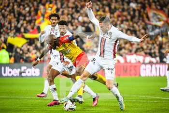 2023-02-01 - Hicham BOUDAOUI of Nice, Seko FOFANA of Lens and Aaron RAMSEY of Nice during the French championship Ligue 1 football match between RC Lens and OGC Nice on February 1, 2023 at Bollaert-Delelis stadium in Lens, France - FOOTBALL - FRENCH CHAMP - LENS V NICE - FRENCH LIGUE 1 - SOCCER