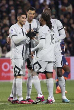 2023-02-01 - Achraf Hakimi of PSG celebrates his goal with Hugo Ekitike, Renato Sanches during the French championship Ligue 1 football match between Montpellier HSC and Paris Saint-Germain on February 1, 2023 at La Mosson-Mondial 98 stadium in Montpellier, France - FOOTBALL - FRENCH CHAMP - MONTPELLIER V PARIS SG - FRENCH LIGUE 1 - SOCCER