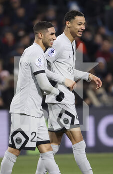 2023-02-01 - Achraf Hakimi of PSG celebrates his goal with Hugo Ekitike during the French championship Ligue 1 football match between Montpellier HSC and Paris Saint-Germain on February 1, 2023 at La Mosson-Mondial 98 stadium in Montpellier, France - FOOTBALL - FRENCH CHAMP - MONTPELLIER V PARIS SG - FRENCH LIGUE 1 - SOCCER