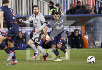 2023-02-02 - Lionel Messi of PSG, Teji Savanier of Montpellier during the French championship Ligue 1 football match between Montpellier HSC and Paris Saint-Germain on February 1, 2023 at La Mosson-Mondial 98 stadium in Montpellier, France - FOOTBALL - FRENCH CHAMP - MONTPELLIER V PARIS SG - FRENCH LIGUE 1 - SOCCER