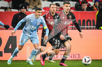 2023-02-10 - Riad NOURI of Ajaccio, Aaron RAMSEY of Nice and Badredine BOUANANI of Nice during the French championship Ligue 1 football match between OGC Nice and AC Ajaccio on February 10, 2023 at Allianz Riviera stadium in Nice, France - FOOTBALL - FRENCH CHAMP - NICE V AJACCIO - FRENCH LIGUE 1 - SOCCER