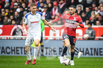 2023-02-12 - Maxime LE MARCHAND of Strasbourg and Remy CABELLA of Lille during the French championship Ligue 1 football match between Losc Lille and RC Strasbourg on February 12, 2023 at Pierre Mauroy stadium in Villeneuve-d'Ascq near Lille, France - FOOTBALL - FRENCH CHAMP - LILLE V STRASBOURG - FRENCH LIGUE 1 - SOCCER