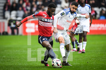 2023-02-12 - Jonathan BAMBA of Lille and Morgan SANSON of Strasbourg during the French championship Ligue 1 football match between Losc Lille and RC Strasbourg on February 12, 2023 at Pierre Mauroy stadium in Villeneuve-d'Ascq near Lille, France - FOOTBALL - FRENCH CHAMP - LILLE V STRASBOURG - FRENCH LIGUE 1 - SOCCER