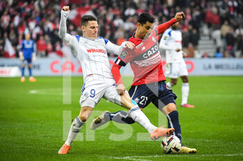 2023-02-12 - Kevin GAMEIRO of Strasbourg and Benjamin ANDRE of Lille during the French championship Ligue 1 football match between Losc Lille and RC Strasbourg on February 12, 2023 at Pierre Mauroy stadium in Villeneuve-d'Ascq near Lille, France - FOOTBALL - FRENCH CHAMP - LILLE V STRASBOURG - FRENCH LIGUE 1 - SOCCER