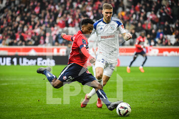 2023-02-12 - Angel GOMES of Lille and Maxime LE MARCHAND of Strasbourg during the French championship Ligue 1 football match between Losc Lille and RC Strasbourg on February 12, 2023 at Pierre Mauroy stadium in Villeneuve-d'Ascq near Lille, France - FOOTBALL - FRENCH CHAMP - LILLE V STRASBOURG - FRENCH LIGUE 1 - SOCCER