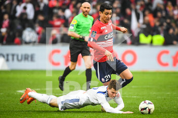 2023-02-12 - Benjamin ANDRE of Lille and Eduard SOBOL of Strasbourg during the French championship Ligue 1 football match between Losc Lille and RC Strasbourg on February 12, 2023 at Pierre Mauroy stadium in Villeneuve-d'Ascq near Lille, France - FOOTBALL - FRENCH CHAMP - LILLE V STRASBOURG - FRENCH LIGUE 1 - SOCCER