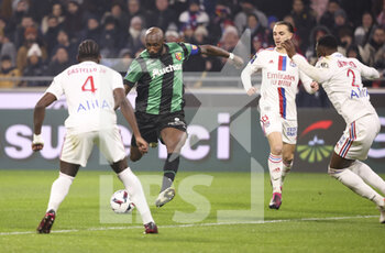 2023-02-12 - Seko Fofana of Lens, Maxence Caqueret of Lyon during the French championship Ligue 1 football match between Olympique Lyonnais (OL) and RC Lens (RCL) on February 12, 2023 at Groupama stadium in Decines-Charpieu near Lyon, France - FOOTBALL - FRENCH CHAMP - LYON V LENS - FRENCH LIGUE 1 - SOCCER
