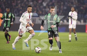 2023-02-12 - Jonathan Gradit of Lens, Corentin Tolisso of Lyon (left) during the French championship Ligue 1 football match between Olympique Lyonnais (OL) and RC Lens (RCL) on February 12, 2023 at Groupama stadium in Decines-Charpieu near Lyon, France - FOOTBALL - FRENCH CHAMP - LYON V LENS - FRENCH LIGUE 1 - SOCCER