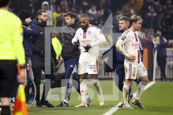 2023-02-12 - Injured, Alexandre Lacazette of Lyon leaves the pitch during the French championship Ligue 1 football match between Olympique Lyonnais (OL) and RC Lens (RCL) on February 12, 2023 at Groupama stadium in Decines-Charpieu near Lyon, France - FOOTBALL - FRENCH CHAMP - LYON V LENS - FRENCH LIGUE 1 - SOCCER