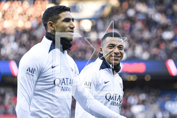 2023-02-24 - Achraf Hakimi and Kylian Mbappe during the public training of the Paris Saint-Germain (PSG) football team on February 24, 2023 at the Parc des Princes stadium in Paris, France - FOOTBALL - TRAINING OF THE PARIS SG TEAM - FRENCH LIGUE 1 - SOCCER