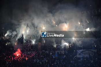 2023-02-26 - Supporters of Marseille using smoke bombs during the French championship Ligue 1 football match between Olympique de Marseille and Paris Saint-Germain on February 26, 2023 at Velodrome stadium in Marseille, France - FOOTBALL - FRENCH CHAMP - MARSEILLE V PARIS SG - FRENCH LIGUE 1 - SOCCER