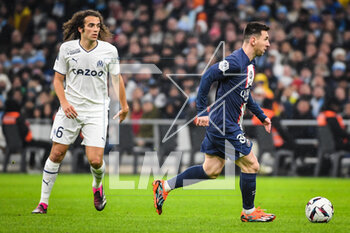 2023-02-26 - Matteo GUENDOUZI of Marseille and Lionel (Leo) MESSI of PSG during the French championship Ligue 1 football match between Olympique de Marseille and Paris Saint-Germain on February 26, 2023 at Velodrome stadium in Marseille, France - FOOTBALL - FRENCH CHAMP - MARSEILLE V PARIS SG - FRENCH LIGUE 1 - SOCCER
