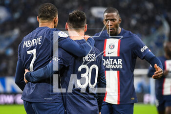 2023-02-26 - Kylian MBAPPE of PSG celebrate his goal with Lionel (Leo) MESSI of PSG and Nordi MUKIELE of PSG during the French championship Ligue 1 football match between Olympique de Marseille and Paris Saint-Germain on February 26, 2023 at Velodrome stadium in Marseille, France - FOOTBALL - FRENCH CHAMP - MARSEILLE V PARIS SG - FRENCH LIGUE 1 - SOCCER