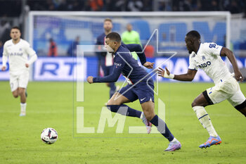 2023-02-26 - Kylian Mbappe of PSG, Eric Bailly of Marseille during the French championship Ligue 1 football match between Olympique de Marseille (OM) and Paris Saint-Germain (PSG) on February 26, 2023 at Stade Velodrome in Marseille, France - FOOTBALL - FRENCH CHAMP - MARSEILLE V PARIS SG - FRENCH LIGUE 1 - SOCCER
