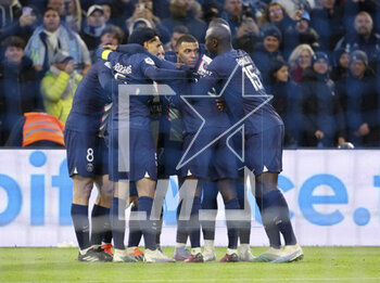 2023-02-26 - Kylian Mbappe of PSG celebrates his first goal with teammates during the French championship Ligue 1 football match between Olympique de Marseille (OM) and Paris Saint-Germain (PSG) on February 26, 2023 at Stade Velodrome in Marseille, France - FOOTBALL - FRENCH CHAMP - MARSEILLE V PARIS SG - FRENCH LIGUE 1 - SOCCER