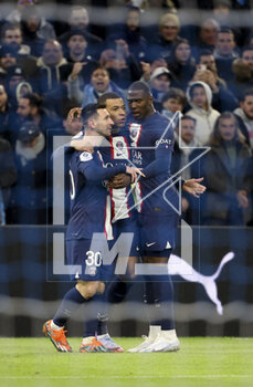 2023-02-26 - Kylian Mbappe of PSG celebrates his first goal with Lionel Messi, Nordi Mukiele during the French championship Ligue 1 football match between Olympique de Marseille (OM) and Paris Saint-Germain (PSG) on February 26, 2023 at Stade Velodrome in Marseille, France - FOOTBALL - FRENCH CHAMP - MARSEILLE V PARIS SG - FRENCH LIGUE 1 - SOCCER