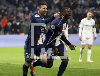 2023-02-26 - Lionel Messi of PSG celebrates his goal with Nuno Mendes during the French championship Ligue 1 football match between Olympique de Marseille (OM) and Paris Saint-Germain (PSG) on February 26, 2023 at Stade Velodrome in Marseille, France - FOOTBALL - FRENCH CHAMP - MARSEILLE V PARIS SG - FRENCH LIGUE 1 - SOCCER