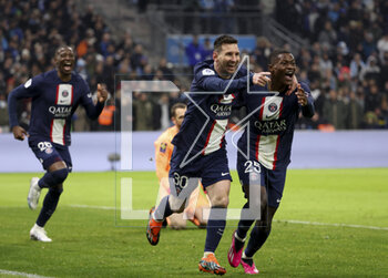 2023-02-26 - Lionel Messi of PSG celebrates his goal with Nuno Mendes, left Nordi Mukiele of PSG during the French championship Ligue 1 football match between Olympique de Marseille (OM) and Paris Saint-Germain (PSG) on February 26, 2023 at Stade Velodrome in Marseille, France - FOOTBALL - FRENCH CHAMP - MARSEILLE V PARIS SG - FRENCH LIGUE 1 - SOCCER