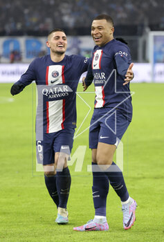 2023-02-26 - Kylian Mbappe of PSG celebrates his second goal with Marco Verratti (left) during the French championship Ligue 1 football match between Olympique de Marseille (OM) and Paris Saint-Germain (PSG) on February 26, 2023 at Stade Velodrome in Marseille, France - FOOTBALL - FRENCH CHAMP - MARSEILLE V PARIS SG - FRENCH LIGUE 1 - SOCCER