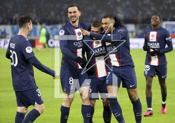 2023-02-26 - Kylian Mbappe of PSG celebrates his second goal with Lionel Messi, Fabian Ruiz Pena, Marco Verratti during the French championship Ligue 1 football match between Olympique de Marseille (OM) and Paris Saint-Germain (PSG) on February 26, 2023 at Stade Velodrome in Marseille, France - FOOTBALL - FRENCH CHAMP - MARSEILLE V PARIS SG - FRENCH LIGUE 1 - SOCCER