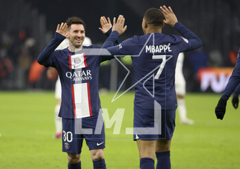 2023-02-26 - Kylian Mbappe of PSG celebrates his second goal with Lionel Messi (left) during the French championship Ligue 1 football match between Olympique de Marseille (OM) and Paris Saint-Germain (PSG) on February 26, 2023 at Stade Velodrome in Marseille, France - FOOTBALL - FRENCH CHAMP - MARSEILLE V PARIS SG - FRENCH LIGUE 1 - SOCCER
