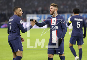 2023-02-26 - Kylian Mbappe of PSG celebrates his second goal with Sergio Ramos during the French championship Ligue 1 football match between Olympique de Marseille (OM) and Paris Saint-Germain (PSG) on February 26, 2023 at Stade Velodrome in Marseille, France - FOOTBALL - FRENCH CHAMP - MARSEILLE V PARIS SG - FRENCH LIGUE 1 - SOCCER