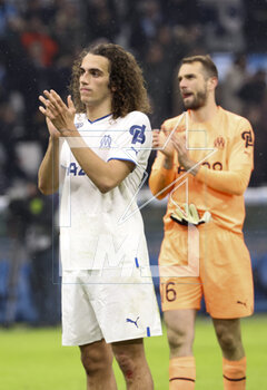 2023-02-26 - Matteo Guendouzi, Marseille goalkeeper Pau Lopez salute the supporters following the French championship Ligue 1 football match between Olympique de Marseille (OM) and Paris Saint-Germain (PSG) on February 26, 2023 at Stade Velodrome in Marseille, France - FOOTBALL - FRENCH CHAMP - MARSEILLE V PARIS SG - FRENCH LIGUE 1 - SOCCER