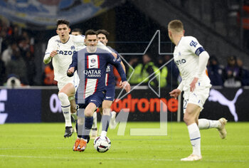 2023-02-26 - Lionel Messi of PSG, Leonardo Balerdi of Marseille (left) during the French championship Ligue 1 football match between Olympique de Marseille (OM) and Paris Saint-Germain (PSG) on February 26, 2023 at Stade Velodrome in Marseille, France - FOOTBALL - FRENCH CHAMP - MARSEILLE V PARIS SG - FRENCH LIGUE 1 - SOCCER