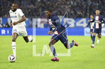 2023-02-26 - Nuno Mendes of PSG, Nuno Tavares of Marseille (left) during the French championship Ligue 1 football match between Olympique de Marseille (OM) and Paris Saint-Germain (PSG) on February 26, 2023 at Stade Velodrome in Marseille, France - FOOTBALL - FRENCH CHAMP - MARSEILLE V PARIS SG - FRENCH LIGUE 1 - SOCCER