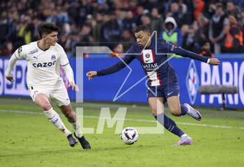 2023-02-26 - Kylian Mbappe of PSG, Leonardo Balerdi of Marseille (left) during the French championship Ligue 1 football match between Olympique de Marseille (OM) and Paris Saint-Germain (PSG) on February 26, 2023 at Stade Velodrome in Marseille, France - FOOTBALL - FRENCH CHAMP - MARSEILLE V PARIS SG - FRENCH LIGUE 1 - SOCCER