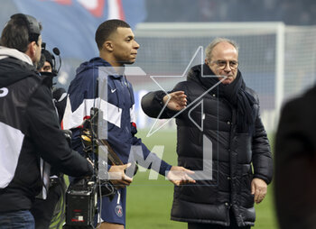 2023-03-05 - Kylian Mbappe of PSG receives a trophy celebrating his 201st goal for PSG, becoming the club's top scorer - here with Luis Campos of PSG - following the French championship Ligue 1 football match between Paris Saint-Germain (PSG) and FC Nantes (FCN) on March 4, 2023 at Parc des Princes stadium in Paris, France - FOOTBALL - FRENCH CHAMP - PARIS SG V NANTES - FRENCH LIGUE 1 - SOCCER