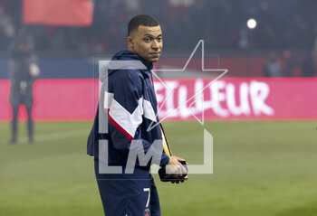 2023-03-05 - Kylian Mbappe of PSG receives a trophy celebrating his 201st goal for PSG, becoming the club's top scorer, during a ceremony following the French championship Ligue 1 football match between Paris Saint-Germain (PSG) and FC Nantes (FCN) on March 4, 2023 at Parc des Princes stadium in Paris, France - FOOTBALL - FRENCH CHAMP - PARIS SG V NANTES - FRENCH LIGUE 1 - SOCCER
