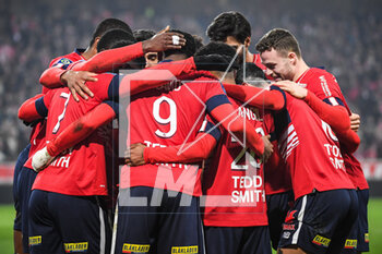 2023-03-10 - Jonathan DAVID of Lille celebrate his goal with teammates during the French championship Ligue 1 football match between LOSC Lille and Olympique Lyonnais (Lyon) on March 10, 2023 at Pierre Mauroy stadium in Villeneuve-d'Ascq near Lille, France - FOOTBALL - FRENCH CHAMP - LILLE V LYON - FRENCH LIGUE 1 - SOCCER