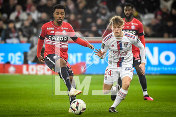2023-03-10 - Angel GOMES of Lille and Johann LEPENANT of Lyon during the French championship Ligue 1 football match between LOSC Lille and Olympique Lyonnais (Lyon) on March 10, 2023 at Pierre Mauroy stadium in Villeneuve-d'Ascq near Lille, France - FOOTBALL - FRENCH CHAMP - LILLE V LYON - FRENCH LIGUE 1 - SOCCER