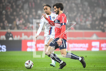 2023-03-10 - Andre GOMES of Lille and Bradley BARCOLA of Lyon during the French championship Ligue 1 football match between LOSC Lille and Olympique Lyonnais (Lyon) on March 10, 2023 at Pierre Mauroy stadium in Villeneuve-d'Ascq near Lille, France - FOOTBALL - FRENCH CHAMP - LILLE V LYON - FRENCH LIGUE 1 - SOCCER