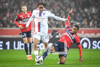 2023-03-10 - Bradley BARCOLA of Lyon and Alexsandro VICTOR DE SOUZA RIBEIRO of Lille during the French championship Ligue 1 football match between LOSC Lille and Olympique Lyonnais (Lyon) on March 10, 2023 at Pierre Mauroy stadium in Villeneuve-d'Ascq near Lille, France - FOOTBALL - FRENCH CHAMP - LILLE V LYON - FRENCH LIGUE 1 - SOCCER