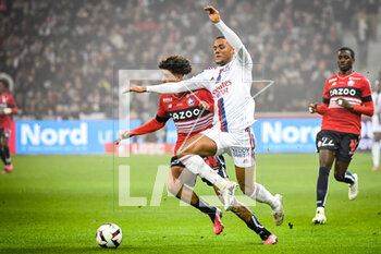2023-03-10 - Leny YORO of Lille and Amin SARR of Lyon during the French championship Ligue 1 football match between LOSC Lille and Olympique Lyonnais (Lyon) on March 10, 2023 at Pierre Mauroy stadium in Villeneuve-d'Ascq near Lille, France - FOOTBALL - FRENCH CHAMP - LILLE V LYON - FRENCH LIGUE 1 - SOCCER