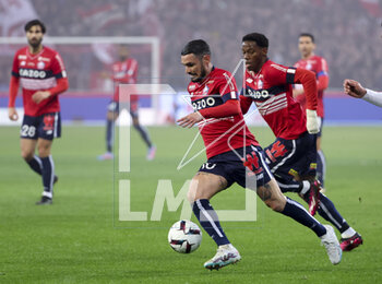 2023-03-10 - Remy Cabella, Jonathan David of Lille during the French championship Ligue 1 football match between Losc Lille and Olympique Lyonnais (Lyon) on March 10, 2023 at Pierre Mauroy stadium in Villeneuve-d'Ascq near Lille, France - FOOTBALL - FRENCH CHAMP - LILLE V LYON - FRENCH LIGUE 1 - SOCCER