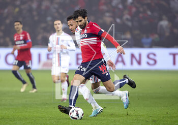 2023-03-10 - Andre Gomes of Lille, Corentin Tolisso of Lyon (left) during the French championship Ligue 1 football match between Losc Lille and Olympique Lyonnais (Lyon) on March 10, 2023 at Pierre Mauroy stadium in Villeneuve-d'Ascq near Lille, France - FOOTBALL - FRENCH CHAMP - LILLE V LYON - FRENCH LIGUE 1 - SOCCER