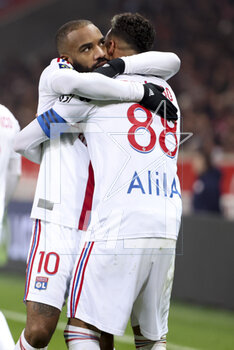 2023-03-10 - Alexandre Lacazette of Lyon celebrates his goal with Corentin Tolisso during the French championship Ligue 1 football match between Losc Lille and Olympique Lyonnais (Lyon) on March 10, 2023 at Pierre Mauroy stadium in Villeneuve-d'Ascq near Lille, France - FOOTBALL - FRENCH CHAMP - LILLE V LYON - FRENCH LIGUE 1 - SOCCER