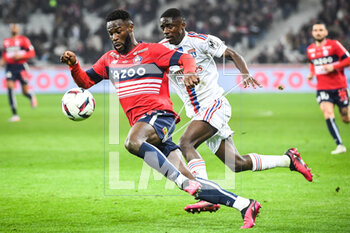 2023-03-10 - Jonathan BAMBA of Lille and Sael KUMBEDI of Lyon during the French championship Ligue 1 football match between LOSC Lille and Olympique Lyonnais (Lyon) on March 10, 2023 at Pierre Mauroy stadium in Villeneuve-d'Ascq near Lille, France - FOOTBALL - FRENCH CHAMP - LILLE V LYON - FRENCH LIGUE 1 - SOCCER