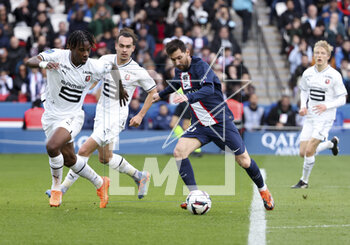 2023-03-19 - Lionel Messi of PSG, left Christopher Wooh, Arthur Theate of Rennes during the French championship Ligue 1 football match between Paris Saint-Germain and Stade Rennais (Rennes) on March 19, 2023 at Parc des Princes stadium in Paris, France - FOOTBALL - FRENCH CHAMP - PARIS SG V RENNES - FRENCH LIGUE 1 - SOCCER