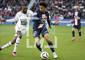2023-03-19 - Warren Zaire-Emery of PSG, Karl Toko Ekambi of Rennes (left) during the French championship Ligue 1 football match between Paris Saint-Germain and Stade Rennais (Rennes) on March 19, 2023 at Parc des Princes stadium in Paris, France - FOOTBALL - FRENCH CHAMP - PARIS SG V RENNES - FRENCH LIGUE 1 - SOCCER